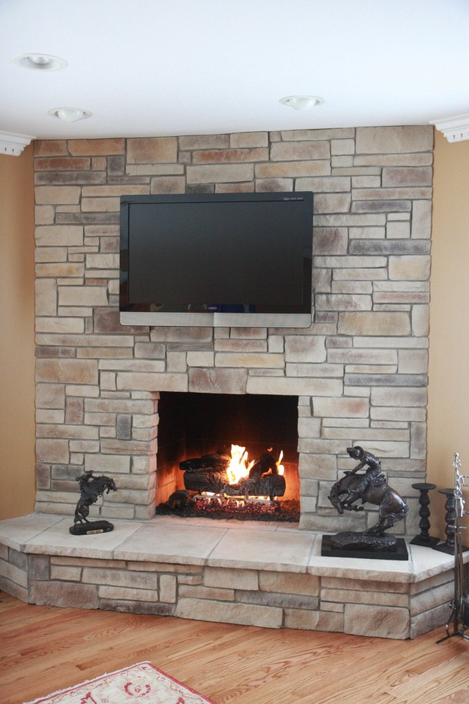 Mountain ledgestone dry stack veneer fireplace with horse statues