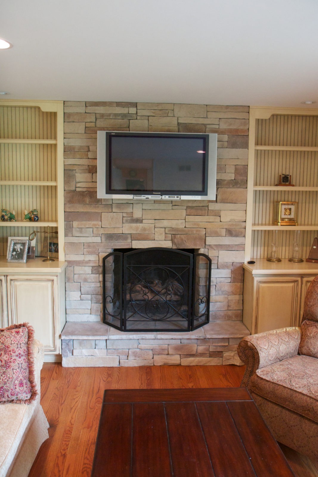 Mountain ledgestone dry stack fireplace with a fireplace screen