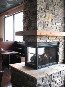 Mountain ledgestone veneer fireplace in a commercial space
