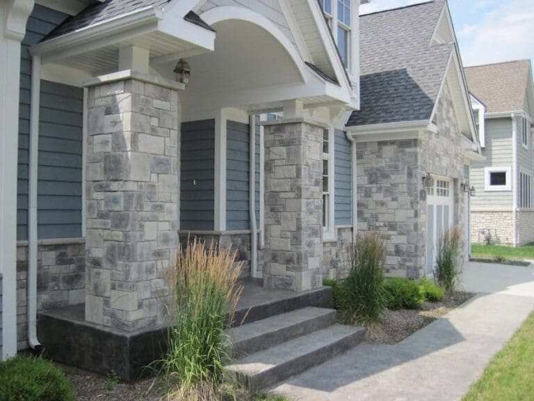 light blue house with castle rock veneer