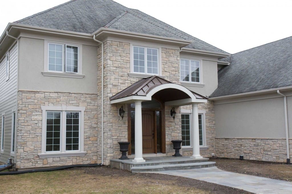 Home with cobble stack stone veneer on its exterior